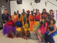 a group of people posing for a photo in a studio