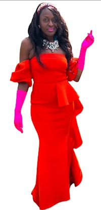 a woman wearing a red dress and pink gloves